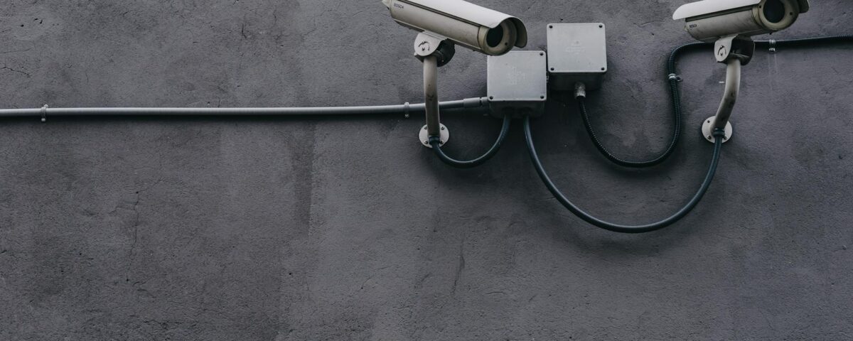 two gray bullet security cameras