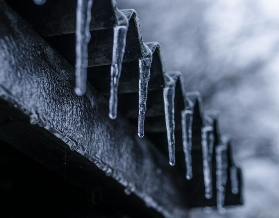 close up photography of ice crystals on edges of corrugated sheets