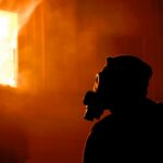 silhouette of man wearing helmet and goggles